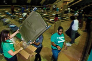 student prepare cots for evacuees from Gustav and Ike