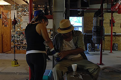 Boxer getting hands wrapped by coach