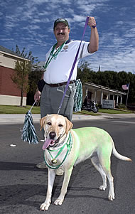 Green colored dog with owner