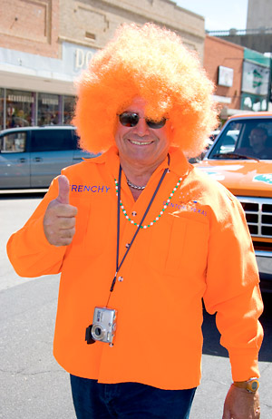 Man with bright orange wig and matching shirt