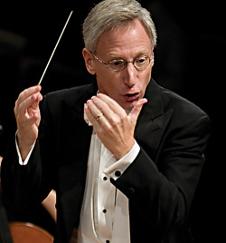 David Itkin conducts an orchestra. (Photo by Michael Clements)