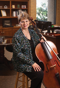 Freelance cellist for the Fort Worth and Dallas symphonies, Debbie Brooks (’77, ’81 M.M.), also organizes orchestras for big-name performers across the state and nation. (Photo by Angilee Wilkerson)