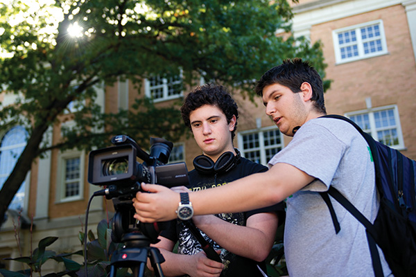 Matthew Beldon, a sophomore radio/TV/film major, right, lives in a REAL community in Kerr Hall with other RTVF majors, like freshman Wynn Smith, left. They are part of a group producing videos advising freshmen about campus life. (Photo by Gary Payne)