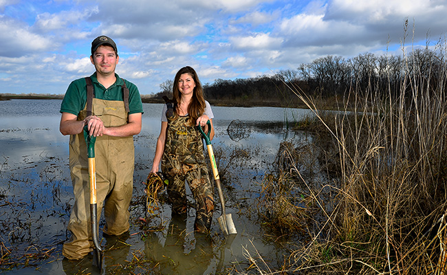Environmental sciences master's student Aaron Schad and Lynde Dodd ('99,'04 M.S.) are part of the U.S. Army Corps of Engineers Engineer Research and Development Center's ecology team. They restore natural ecosystems in urban landscapes, such as a wetland chain in an abandoned golf course as part of the Dallas Floodway Extension Project. (Photo by Michael Clements)