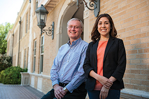 Robert Bland, professor and chair of public administration, with mentee Chelsea Gonzalez ('13 M.P.A.), recent public administration graduate. (Photo by Jonathan Reynolds)