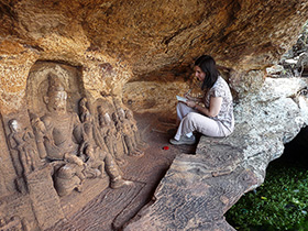 Lisa N. Owen, associate professor of art history, does field work at the site of Badami in Karnataka, India. She earned a Fulbright award to study medieval rock-cut temples for her second book.