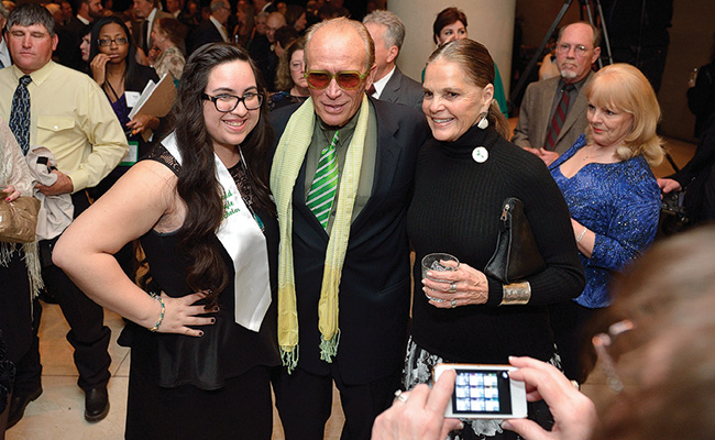 Junior Emerald Eagle Scholar Giselle Garcia with 2014 alumni honoree Peter Weller ('70), and presenter and actress Ali MacGraw. (Photo by Michael Clements)