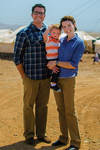 Sarah Nowery ('05, '07 M.P.A.) with her family at a refugee camp in northern Iraq.