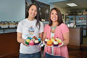 NV Cupcakes - Sisters Van Weaver ('05) and Ngoc Nguyen ('10) build Denton area business baking specialty cakes.(Photo by Michael Clements)