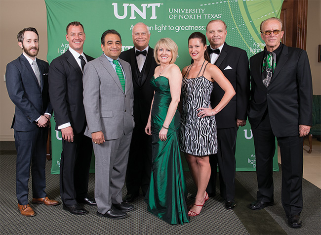 Honored at the Alumni Awards Dinner were, from left, Graham Douglas ('05), C. Tait Cruse ('89), Joe Guerra ('96), Terry Brewer ('65, '70 Ph.D.), Melisa Denis ('86, '86 M.S.), Gabriella Draney ('02), Ernest W. Kuehne Jr. ('66) and Peter Francis Weller ('70). (Photo by Gary Payne) 