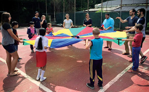 College of Education students participating in outdoor games and activities with children from the Ruth School in Bucharest, Romania, this summer.