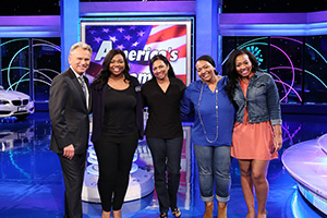 Camille Hall ('08, '10 M.A.) with Pat Sajak (Photo by Carol Kaelson Photographer)