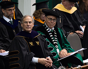 President Neal Smatresk sits with Texas Gov. Greg Abbott, who spoke at May's new University-wide Commencement ceremony. (Photo by Michael Clements)