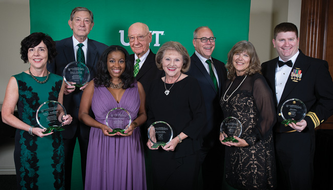 Pictured with President Neal Smatresk, third from right, at the Distinguished Alumni Achievement Awards Dinner are, from left, Julie Anderson ('91, '91 M.S.), Bob Kimmel ('61), Tiffaney Dale Hunter ('01), Leroy Whitaker ('50, '52 M.S.), Cathy Bryce ('91), Barbara Crosby Polansky ('77) of the Hoke family and Kyle Miller, son of Mark Miller ('70, '80). (Photo by Ahna Hubnik)