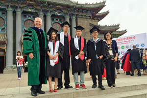 From left, Finley Graves, UNT provost and vice president for academic affairs, with UNT graduates Jiajun Teng ('16), Qi Liu ('16), Binghuan Zhang ('16) and Chen Peng ('16), and UNT-International's program advisor Jiaying 'Cathy' Hu, at June's graduation in China. (Courtesy of UNT-International)
