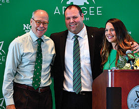 UNT president Neal Smatresk joins new UNT athletic director Wren Baker and his wife Heather at a press conference in Apogee Stadium. (Photo by Michael Clements)