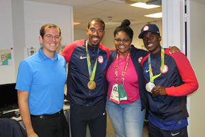 From left to right: Ted Emrich ('09) at the 2016 Rio Summer Olympics with U.S. men's triple jump gold medalist Christian Taylor, NBC Sports commentator Carol Lewis Zilli, and U.S. men's triple jump silver medalist Will Claye.