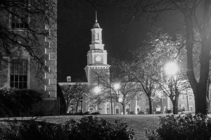 Black-and-white night photo of the Hurley Administration Building