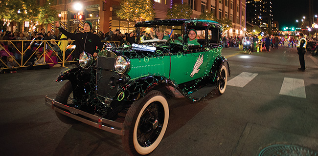 Scrappy and members of the Talons spirit organization drove the Mean Green Machine, a 1929 Model A Tudor Sedan, in the 2016 Fort Worth Parade of Lights in Sundance Square in November. (Photo by Gary Payne)