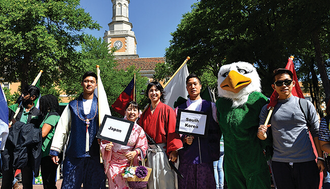 Students from 129 countries call UNT home and participated in the annual Flag Parade during 2017 University Day celebrations. (Photo by Michael Clements)