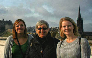 From left, Lucy Ledue ('12), Cynthia Mohr, design associate professor and chair, and Amanda Halston ('12) enjoy the view from the roof of the Museum of Scotland, overlooking Edinburgh Castle.