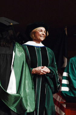 President Gretchen M. Bataille joins more than 3,500 new alumni at graduation. (Photo by Jonathan Reynolds)
