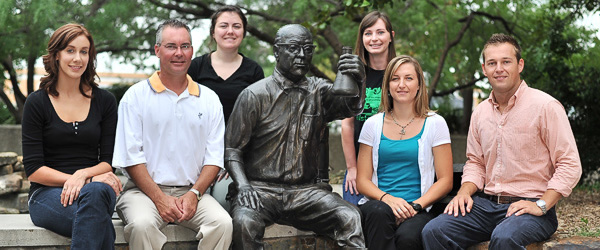 Members of UNT’s Office of Sustainability appear with a statue honoring J.K.G. Silvey at the Environmental Education Science and Technology Building. From left, Lauren Helixon, graduate student; Todd Spinks, director of the Office of Sustainability; Paige Burgess, graduate student; Lauren Lesch, graduate student; Erin Davis, assistant to the director of the Office of Sustainability; Brandon Morton, graduate student.