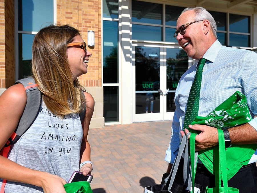 President Neal Smatresk talks with a student outside the Student Union
