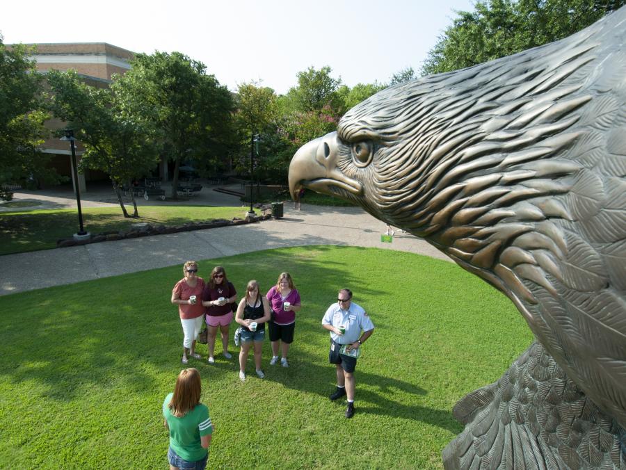 Eagle sculpture "In High Places" overlooking students 