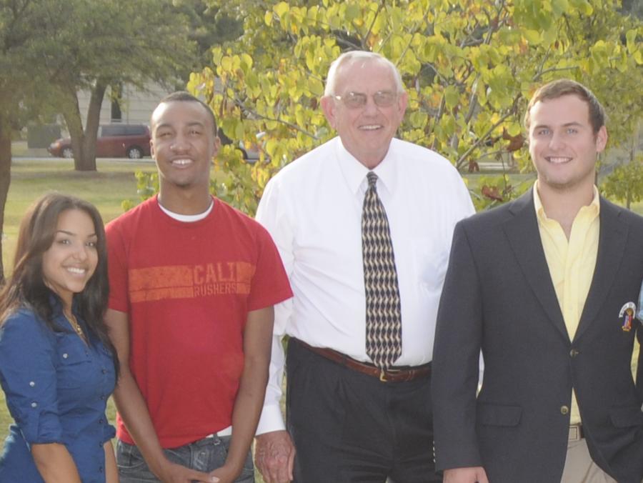 President Lane Rawlins standing with students 