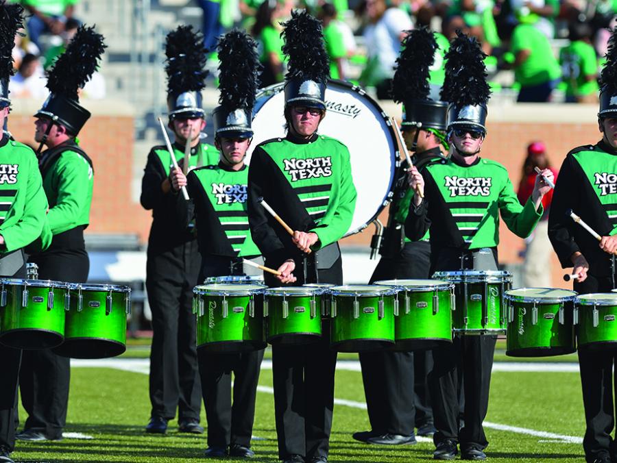 Green Brigade drumline performing at game 