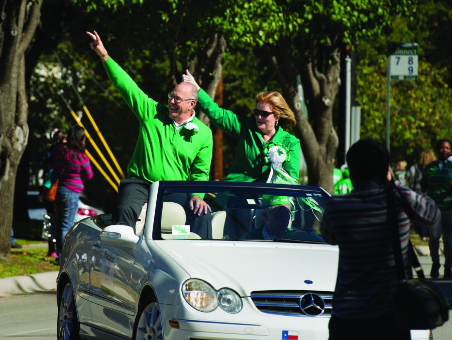 President Neal Smatresk and wife Debbie Smatresk in car at Homecoming Parade