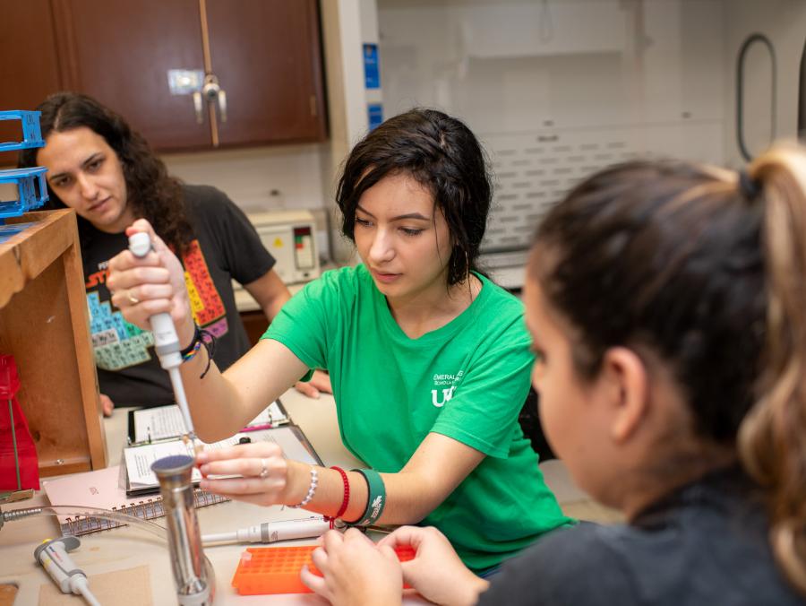 Sonya Layton assists freshman lab students with a biology experienment at UNT