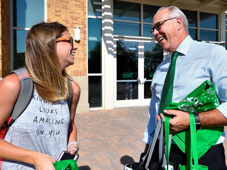 President Neal Smatresk talks with a student outside the Student Union