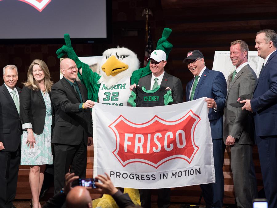 Pictured at left, from left to right: Frisco City Councilman Will Sowell, Frisco Mayor Pro Tem Shona Huffman, Frisco City Councilman Bill Woodard, Scrappy, Frisco Mayor Jeff Cheney, UNT President Neal Smatresk, Frisco Deputy Mayor Pro Tem John Keating and