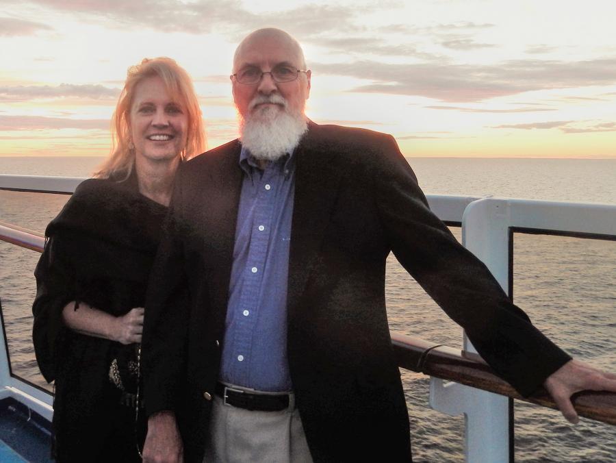 John  and Mary Alda by the railing on a cruise ship at sunset