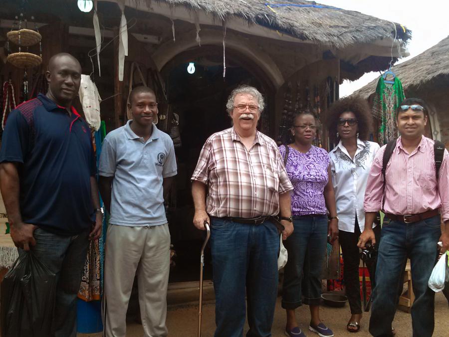 UNT faculty and others standing in Nigerian market