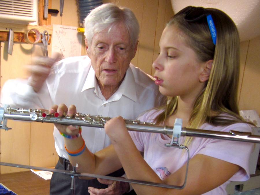 Clarence "Woody" Wood showing flute to Abby Gieseke
