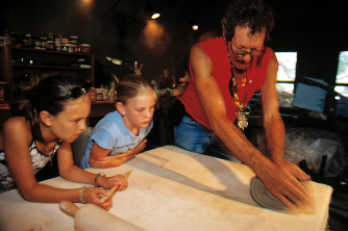 photo of Bill with children sculpting clay