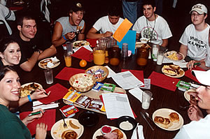 Freshman at a large table eating