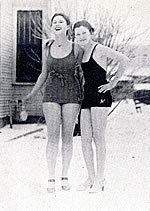 two woman in their bikinis in the snow