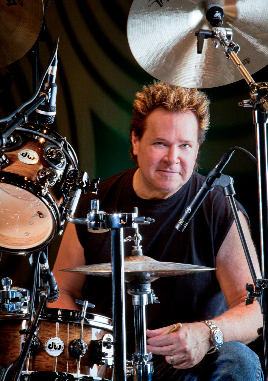Rick Latham seated at his drum kit