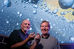 Ron Dilulio and Preston Starr hold small meteors. (Photo by Jonathan Reynolds)