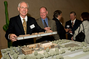College of Business Dean O. Finley Graves presents a model of the Business Leadership Building. (Photo by Mike Woodruff)