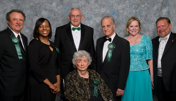 Standing from left: Ben T. Morris (’67), Rosalyn Reades (’02), UNT President V. Lane Rawlins, Jim Bezdek (’50, ’54 M.S.), and Lindy (’72) and John Rydman (’72). Seated: Margaret Irby Nichols (’45). (Photo by Gary Payne)