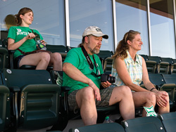 Austin junior Kristen Bennett and her parents, alum James Thomason ('82, '86 M.A.) and Lynne Thomason, check out club level seats at the new stadium.