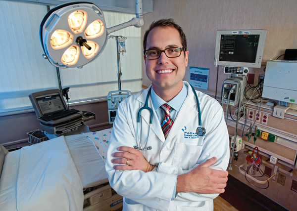 Benjamin Olsson (’99), a pediatric critical care physician, treats children suffering from conditions that become life threatening at Medical City Children's Hospital in Dallas. (Photo by Gary Payne)