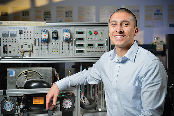 Mechanical and energy engineering senior Andrew Hernandez is helping to develop a solar-powered generator to more efficiently convert sunlight to electricity as part of a senior design capstone class. He also works as an intern with Dallas-based Lennox, a high-efficiency heating and cooling systems company. (Photo by Michael Clements)