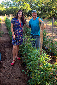 Angilee Wilkerson with Ryan Crocker ('06), owner of Earthwise Gardens and Produce who runs JBG Denton CSA.