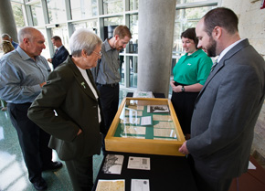 Attendees of the 2015 State of the University look at a speech written and delivered by founding President Joshua Chilton to commemorate the opening of the Texas Normal College and Teacher Training Institute. (Photo by Gary Payne) 
